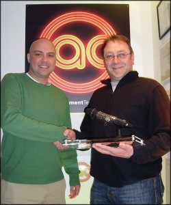 Peter Butler recieves him prize, the first Sennheiser G3 Crystal Roc microphone.